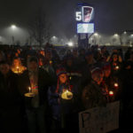 
              FILE - Buffalo Bills fans and community members gather for a candlelight vigil for Buffalo Bills safety Damar Hamlin on Tuesday, Jan. 3, 2023, in Orchard Park, N.Y. The Buffalo Bills have been a reliable bright spot for a city that has been shaken by a racist mass shooting and back-to-back snowstorms in recent months. So when Bills safety Damar Hamlin was critically hurt in a game Monday, the city quickly looked for ways to support the team. (AP Photo/Joshua Bessex)
            