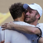 
              Tommy Paul, right, of the U.S. is congratulated by compatriot Ben Shelton following their quarterfinal match at the Australian Open tennis championship in Melbourne, Australia, Wednesday, Jan. 25, 2023. (AP Photo/Dita Alangkara)
            