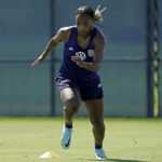 
              U.S. national team player Crystal Dunn takes part in a drill during practice for a match against Nigeria Tuesday, Aug. 30, 2022, in Riverside, Mo. Women’s soccer in the United States has struggled with diversity, starting with a pay-to-play model that can exclude talented kids from communities of color. (AP Photo/Charlie Riedel)
            