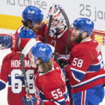 
              Montreal Canadiens goaltender Sam Montembeault, center, celebrates with teammates after defeating the Winnipeg Jets in an  NHL hockey game, Tuesday, Jan. 17, 2023 in Montreal. (Graham Hughes/The Canadian Press via AP)
            