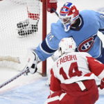 
              Detroit Red Wings' Robby Fabbri (14) scores against Montreal Canadiens goaltender Jake Allen (34) during overtime NHL hockey game action in Montreal, Thursday, Jan. 26, 2023. (Graham Hughes/The Canadian Press via AP)
            