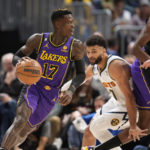 
              Los Angeles Lakers guard Dennis Schroder, left, drives to the basket past Denver Nuggets guard Jamal Murray in the first half of an NBA basketball game Monday, Jan. 9, 2023, in Denver. (AP Photo/David Zalubowski)
            
