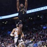 
              Toronto Raptors forward O.G. Anunoby (3) drives to the basket as New York Knicks guard Evan Fournier (13) looks on during the first half of an NBA basketball game Friday, Jan. 6, 2023, in Toronto. (Cole Burston/The Canadian Press via AP)
            