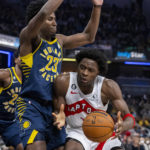 
              Toronto Raptors forward O.G. Anunoby is defended by Indiana Pacers forward Aaron Nesmith (23) during the first half of an NBA basketball game in Indianapolis, Monday, Jan. 2, 2023. (AP Photo/Doug McSchooler)
            