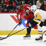 
              Washington Capitals left wing Alex Ovechkin, back, skates with the puck against Pittsburgh Penguins defenseman Brian Dumoulin during the first period of an NHL hockey game Thursday, Jan. 26, 2023, in Washington. (AP Photo/Nick Wass)
            