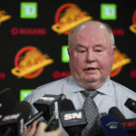 
              Vancouver Canucks coach Bruce Boudreau responds to questions during a news conference after the team's NHL hockey game against the Edmonton Oilers on Saturday, Jan. 21, 2023, in Vancouver, British Columbia. (Darryl Dyck/The Canadian Press via AP)
            