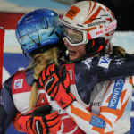 
              Slovakia's Petra Vlhova, right, hugs second placed United States' Mikaela Shiffrin after winning an alpine ski, women's World Cup slalom in Flachau, Austria, Tuesday, Jan.10, 2023. (AP Photo/Giovanni Auletta)
            