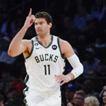 
              Milwaukee Bucks' Brook Lopez (11) gestures after making a 3-point basket during the first half of an NBA basketball game against the New York Knicks, Monday, Jan. 9, 2023, in New York. (AP Photo/Frank Franklin II)
            