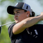 
              FILE - Ash Barty hits off the sixth tee during the Icons Series USA 2022 golf tournament, Thursday, June 30, 2022, at Liberty National Golf Course in Jersey City, N.J. Shocking everyone except a few close friends and family, the 2022 Australian Open women's singles tennis champion announced her retirement in March. Since, she's married her long-time partner, written a book, improved on her golf game and won two major Australian sports awards to end the year.  And she says she has no plans to return to tennis. (AP Photo/John Minchillo, File)
            