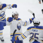 
              Buffalo Sabres' Jeff Skinner (53), Tage Thompson (72), Owen Power (25), Jack Quinn (22) and Rasmus Dahlin (26) celebrate Power's goal against the Winnipeg Jets during the second period of an NHL hockey game Thursday, Jan. 26, 2023, in Winnipeg, Manitoba. (John Woods/The Canadian Press via AP)
            