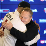 
              Minnesota Twins' Carlos Correa, left, and agent Scott Boras hug following a baseball press conference at Target Field, Wednesday, Jan. 11, 2023, in Minneapolis. The team and Correa agreed to a six-year, $200 million contract. (AP Photo/Abbie Parr)
            