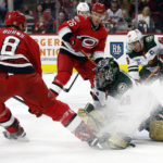 
              Carolina Hurricanes' Brent Burns (8) slips the puck past Minnesota Wild goaltender Marc-Andre Fleury (29) for a goal with Hurricanes' Paul Stastny (26) and Wild's Jared Spurgeon (46) nearby during the second period of an NHL hockey game in Raleigh, N.C., Thursday, Jan. 19, 2023. (AP Photo/Karl B DeBlaker)
            