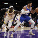 
              Los Angeles Lakers forward Wenyen Gabriel (35) and Philadelphia 76ers forward Tobias Harris (12) reach for a rebound during the first half of an NBA basketball game in Los Angeles, Sunday, Jan. 15, 2023. (AP Photo/Ashley Landis)
            
