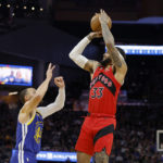 
              Toronto Raptors guard Gary Trent Jr. (33) shoots against Golden State Warriors guard Stephen Curry, left, during the first half of an NBA basketball game in San Francisco, Friday, Jan. 27, 2023. (AP Photo/Jed Jacobsohn)
            