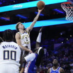 
              Indiana Pacers' Chris Duarte (3) goes up for a shot against Philadelphia 76ers' Montrezl Harrell (5) during the first half of an NBA basketball game, Wednesday, Jan. 4, 2023, in Philadelphia. (AP Photo/Matt Slocum)
            