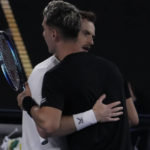 
              Andy Murray of Britain at left hugs Thanasi Kokkinakis of Australia after defeating him at the Australian Open tennis championship in Melbourne, Australia, Friday, Jan. 20, 2023. (AP Photo/Ng Han Guan)
            