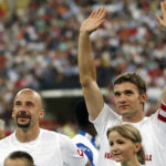 
              FILE - AC Milan Ukrainian soccer star Andriy Shevchenko, right, waves with former Italian striker Gianluca Vialli prior to the start the "Partita del Cuore" charity soccer match event at the San Siro stadium in Milan, Italy, Tuesday, May 31, 2005. Gianluca Vialli, the former Italy striker who helped both Sampdoria and Juventus win Serie A and European trophies before becoming a player-manager at Chelsea, has died on Friday, Jan. 6, 2023. He was 58. 
 (AP Photo/Antonio Calanni, File)
            