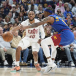 
              Cleveland Cavaliers guard Darius Garland, left, looks to drive to the basket as Denver Nuggets guard Kentavious Caldwell-Pope defends in the first half of an NBA basketball game Friday, Jan. 6, 2023, in Denver. (AP Photo/David Zalubowski)
            