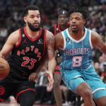 
              Toronto Raptors guard Fred VanVleet (23) is defended by Charlotte Hornets guard Dennis Smith Jr. (8) during the first half of an NBA basketball game Thursday, Jan. 12, 2023, in Toronto. (Frank Gunn/The Canadian Press via AP)
            