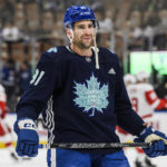 
              Toronto Maple Leafs center John Tavares (91) warms up in a limited edition practice jersey designed by Tyler Tabobondung Rushnell, a 23-year-old Anishinaabe artist, for Indigenous celebration day, before an NHL hockey game against the Detroit Red Wings in Toronto, on Saturday, Jan. 7, 2023. (Christopher Katsarov/The Canadian Press via AP)
            