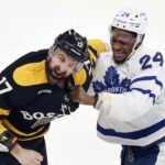 
              Toronto Maple Leafs' Wayne Simmonds (24) and Boston Bruins' Nick Foligno (17) fight during the first period of an NHL hockey game Saturday, Jan. 14 2023, in Boston. (AP Photo/Michael Dwyer)
            