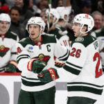 
              Minnesota Wild defenseman Jared Spurgeon, left, celebrates his goal with center Connor Dewar (26) during the second period of an NHL hockey game, Tuesday, Jan. 17, 2023, in Washington. (AP Photo/Nick Wass)
            