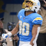 
              Los Angeles Chargers running back Austin Ekeler celebrates his touchdown against the Los Angeles Rams during the first half of an NFL football game Sunday, Jan. 1, 2023, in Inglewood, Calif. (AP Photo/Mark J. Terrill)
            