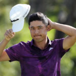 
              Collin Morikawa acknowledges the gallery after the third round of the Tournament of Champions golf event, Saturday, Jan. 7, 2023, at Kapalua Plantation Course in Kapalua, Hawaii. (AP Photo/Matt York)
            