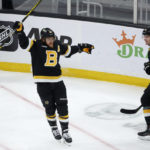 
              Boston Bruins right wing David Pastrnak celebrates with teammate Pavel Zacha (18) after scoring a goal during the first period of an NHL hockey game against the Philadelphia Flyers, Monday, Jan. 16, 2023, in Boston. (AP Photo/Mary Schwalm)
            