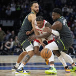 
              Houston Rockets guard Jalen Green, center, loses control of the ball while defended by Minnesota Timberwolves forward Kyle Anderson, left, and guard Anthony Edwards during the second half of an NBA basketball game, Saturday, Jan. 21, 2023, in Minneapolis. (AP Photo/Abbie Parr)
            