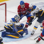 
              Montreal Canadiens' Jonathan Drouin (27) scores against St. Louis Blues goaltender Jordan Binnington (50) as Blues' Josh Leivo, second from right, and Canadiens' Josh Anderson, top left, look for a rebound during third-period NHL hockey game action in Montreal, Saturday, Jan. 7, 2023. (Graham Hughes/The Canadian Press via AP)
            