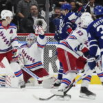 
              New York Rangers goaltender Igor Shesterkin (31) makes a save on a shot from Toronto Maple Leafs forward Auston Matthews (34) during the first period of an NHL hockey game Wednesday, Jan. 25, 2023, in Toronto. (Nathan Denette/The Canadian Press via AP)
            