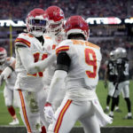 
              Kansas City Chiefs wide receiver Kadarius Toney, left, is congratulated by JuJu Smith-Schuster (9) after scoring on a touchdown run during the first half of an NFL football game against the Las Vegas Raiders Saturday, Jan. 7, 2023, in Las Vegas. (AP Photo/John Locher)
            
