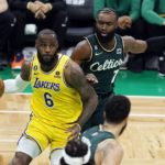 
              Los Angeles Lakers' LeBron James (6) drives for the basket in front of Boston Celtics' Jaylen Brown (7) during the first half of an NBA basketball game, Saturday, Jan. 28, 2023, in Boston. (AP Photo/Michael Dwyer)
            