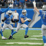 
              Teammates react after Detroit Lions defensive end Aidan Hutchinson intercepted a pass during the first half of an NFL football game against the Chicago Bears, Sunday, Jan. 1, 2023, in Detroit. (AP Photo/Paul Sancya)
            