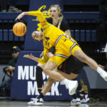 
              California forward Evelien Lutje Schipholt (24) loses control of a rebound in front of Stanford forward Cameron Brink during the first half of an NCAA college basketball game, Sunday, Jan. 8, 2023, in Berkeley, Calif. (AP Photo/D. Ross Cameron)
            