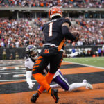 
              Cincinnati Bengals wide receiver Ja'Marr Chase (1) makes a catch in front of Baltimore Ravens cornerback Daryl Worley (41) for a touchdown in the first half of an NFL football game in Cincinnati, Sunday, Jan. 8, 2023. (AP Photo/Joshua A. Bickel)
            