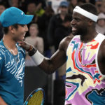 
              Shang Juncheng, left, of China congratulates Frances Tiafoe of the U.S. following their second round match at the Australian Open tennis championship in Melbourne, Australia, Wednesday, Jan. 18, 2023. (AP Photo/Aaron Favila)
            