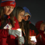 
              Buffalo Bills fans and community members gather for a candlelight vigil for Buffalo Bills safety Damar Hamlin on Tuesday, Jan. 3, 2023, in Orchard Park, N.Y. (AP Photo/Joshua Bessex)
            