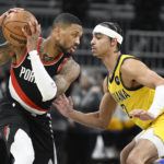 
              Portland Trail Blazers guard Damian Lillard, left, keeps the ball away from Indiana Pacers guard Andrew Nembhard (2) during the second quarter of an NBA basketball game, Friday, Jan. 6, 2023, in Indianapolis. (AP Photo/Marc Lebryk)
            