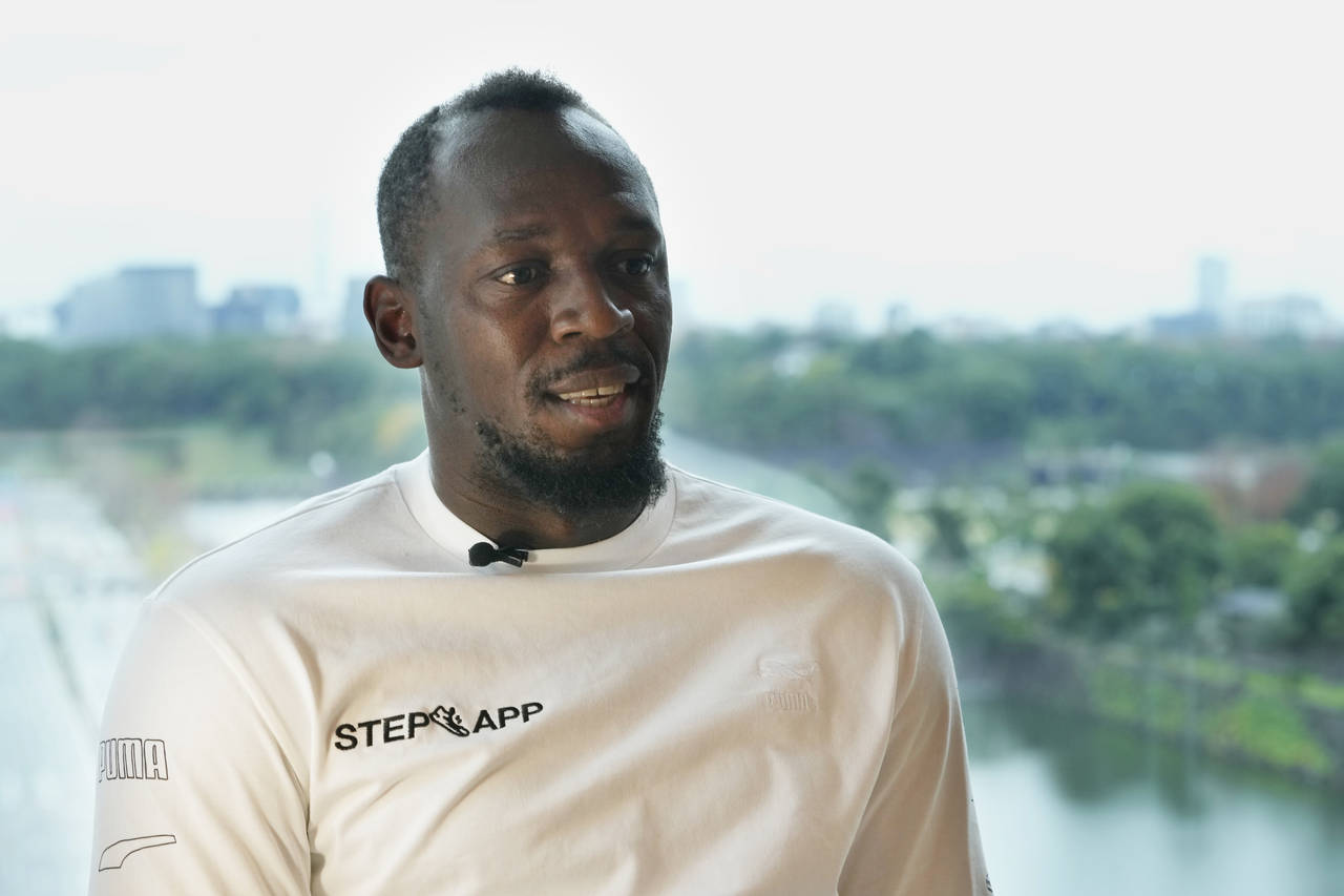 FILE - Usain Bolt, a retired Jamaican sprinter, speaks during an interview in Tokyo, Dec. 1, 2022. ...