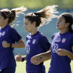 
              U.S. national team player Sophie Smith, right, runs with teammates during practice for a match against Nigeria Tuesday, Aug. 30, 2022, in Riverside, Mo. Women’s soccer in the United States has struggled with diversity, starting with a pay-to-play model that can exclude talented kids from communities of color. (AP Photo/Charlie Riedel)
            