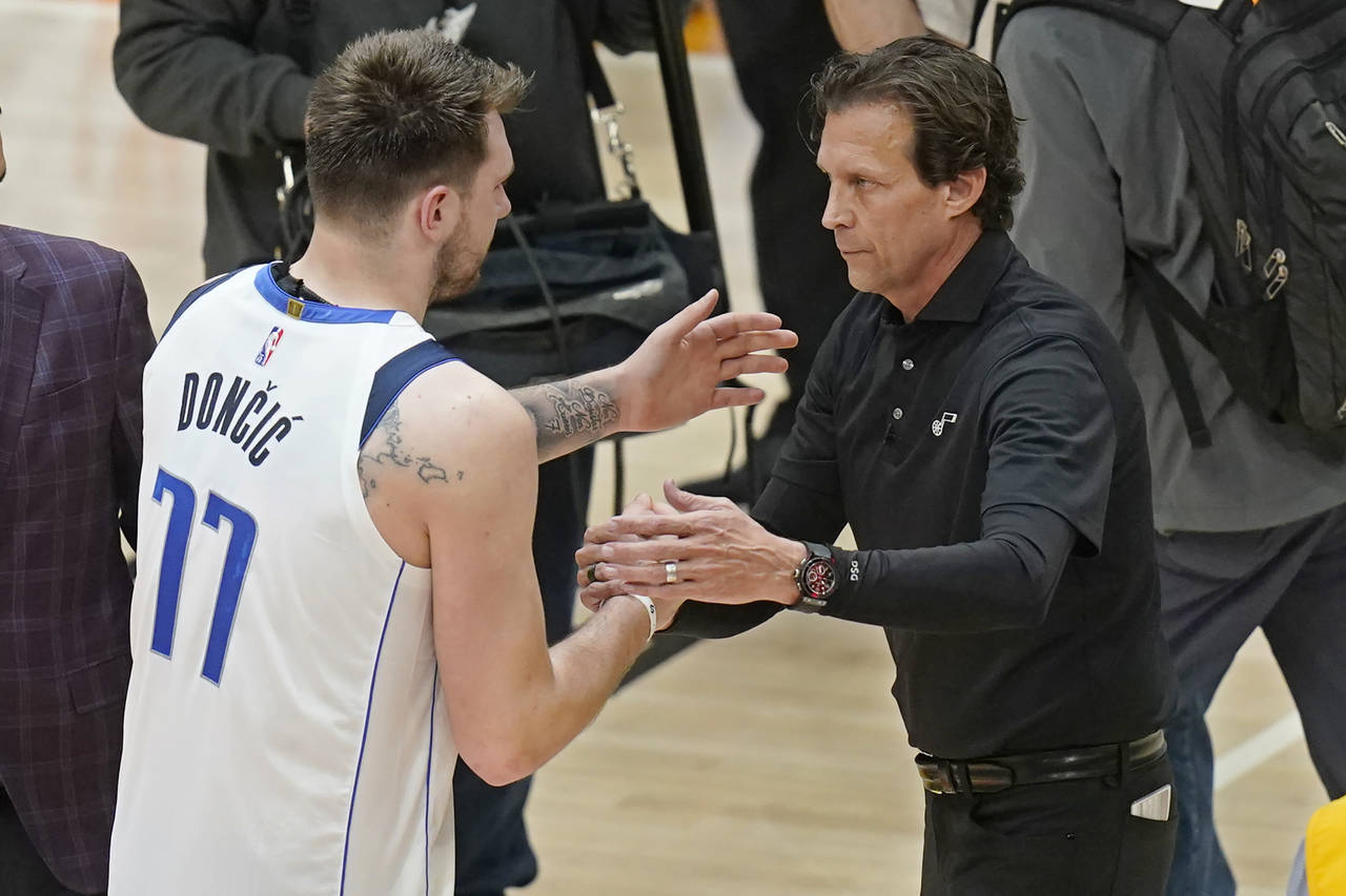 Utah Jazz head coach Quin Snyder, right, greets Dallas Mavericks' Luka Doncic (77)  in Game 6 of an...