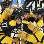 
              Boston Bruins' Matt Grzelcyk (48) celebrates his goal against the Toronto Maple Leafs with teammates during the third period of an NHL hockey game Saturday, Jan. 14 2023, in Boston. (AP Photo/Michael Dwyer)
            