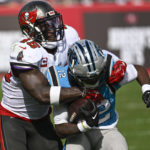 
              Carolina Panthers wide receiver Shi Smith is tackled by Tampa Bay Buccaneers linebacker Devin White during the first half of an NFL football game between the Carolina Panthers and the Tampa Bay Buccaneers on Sunday, Jan. 1, 2023, in Tampa, Fla. (AP Photo/Jason Behnken)
            