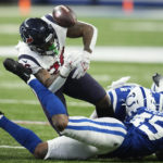 
              Houston Texans running back Royce Freeman (26) fumbles the ball after being tackled during the first half of an NFL football game between the Houston Texans and Indianapolis Colts, Sunday, Jan. 8, 2023, in Indianapolis. (AP Photo/Darron Cummings)
            