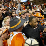 
              Oklahoma State head coach Mike Boynton, Jr. celebrates with fans after a 61-59 victory against Iowa State in the NCAA college basketball game in Stillwater, Okla., Saturday, Jan. 21, 2023. (AP Photo/Mitch Alcala)
            