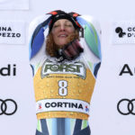 
              Slovenia's Ilka Stuhec celebrates on the podium after winning an alpine ski, women's World Cup downhill race, in Cortina d'Ampezzo, Italy, Saturday, Jan. 21, 2023. (AP Photo/Alessandro Trovati)
            