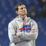 
              FILE - Buffalo Bills offensive coordinator Ken Dorsey looks on prior to an NFL football game, Oct. 30, 2022, in Orchard Park, N.Y. The Carolina Panthers have requested permission to interview four different NFL offensive coordinators for their head coaching vacancy, including Dorsey, Philadelphia’s Shane Steichen, Detroit’s Ben Johnson and New York Giants’ Mike Kafka, according to a person familiar with the situation. (AP Photo/Bryan Bennett, File)
            
