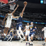 
              Denver Nuggets center Nikola Jokic, right, goes up for a basket as New Orleans Pelicans forward Herbert Jones, left, defends in the first half of an NBA basketball game Tuesday, Jan. 31, 2023, in Denver. (AP Photo/David Zalubowski)
            